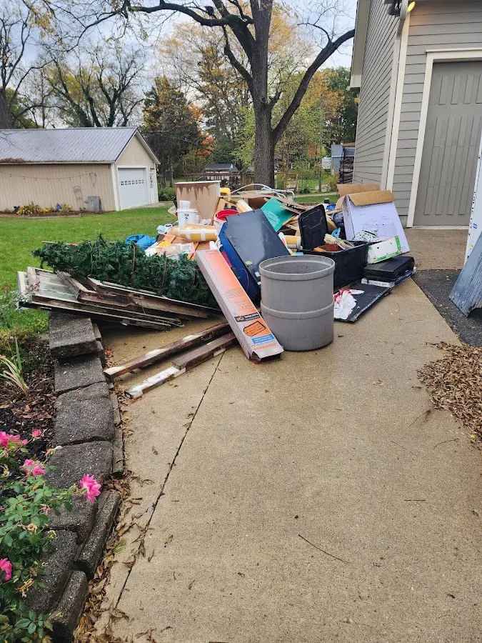 Dumpster being loaded with debris for Commercial Dumpster Rental in Carpentersville